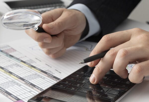business-man-calculating-finance-numbers