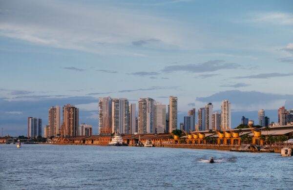 A mesmerizing view of the Brazilian cityscape with an ocean under a cloudy sky