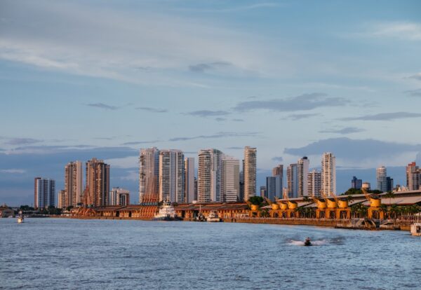 A mesmerizing view of the Brazilian cityscape with an ocean under a cloudy sky